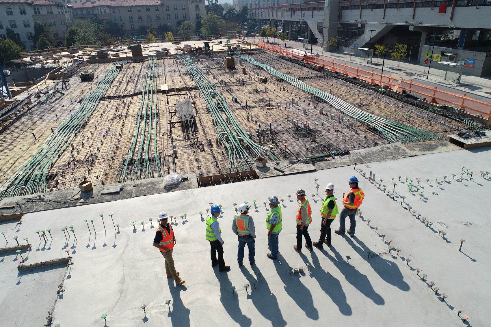 Engineering and construction professionals working together on an active project site